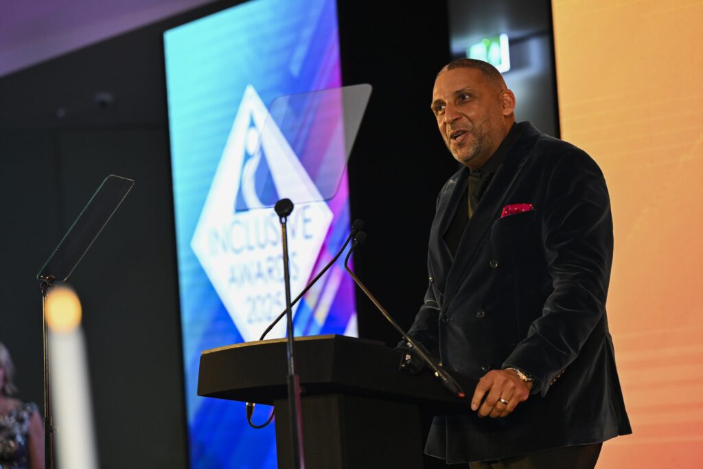 Paul Sesay presenting the 2025 Inclusive Awards.